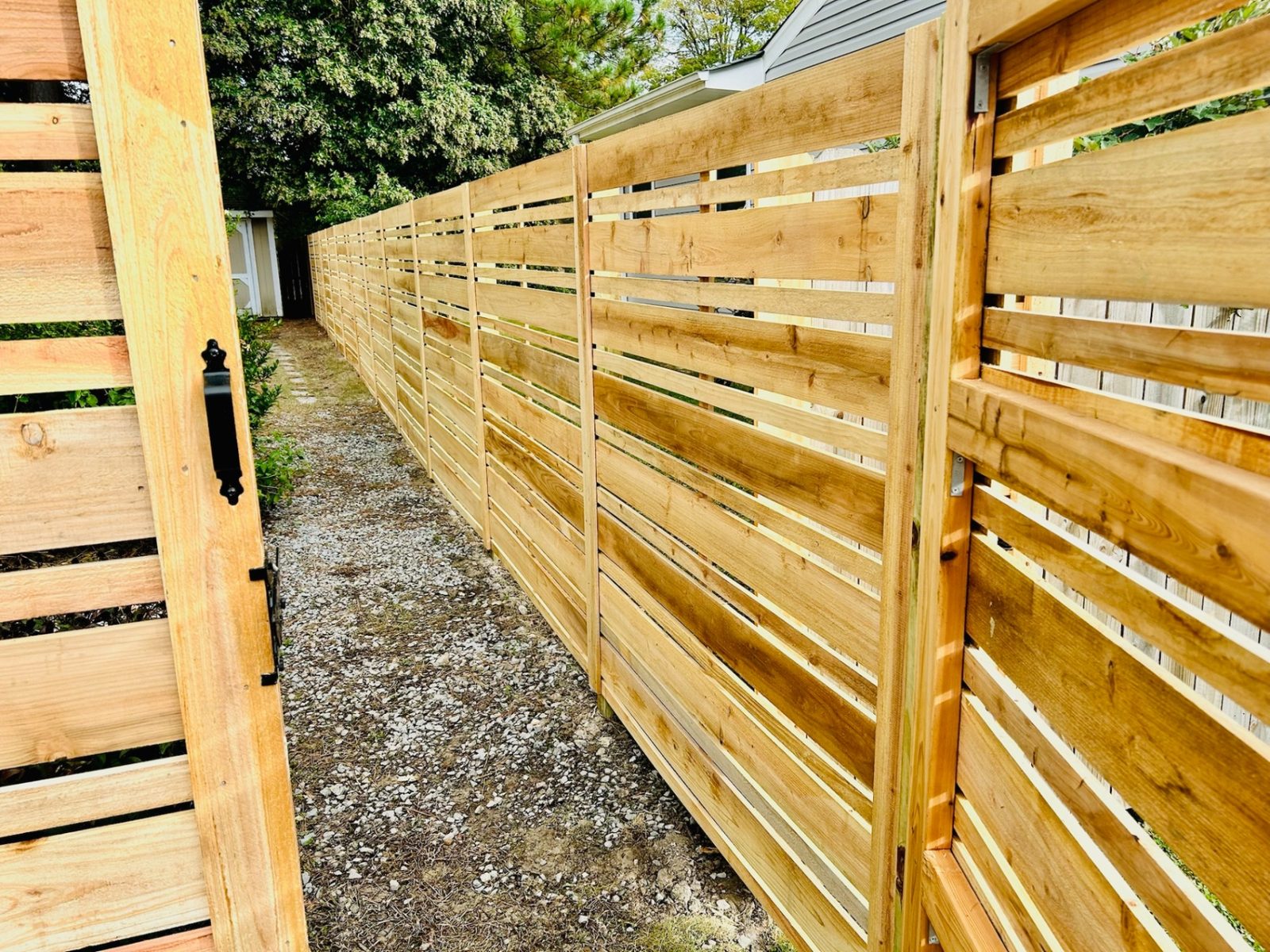 Custom wood fence installation by Chesapeake Fence