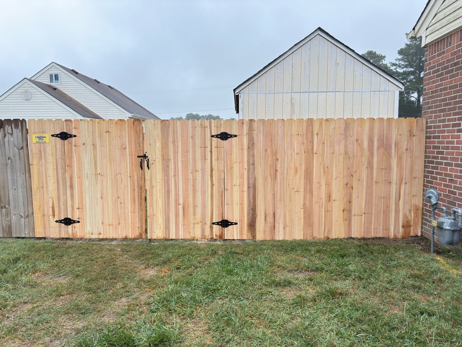 Tall privacy fence with gate